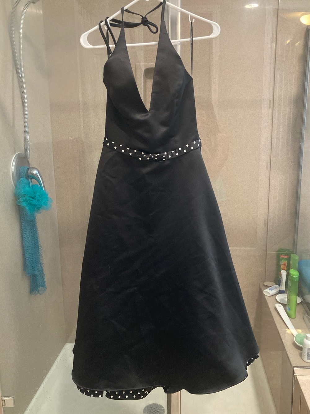 Black cocktail gown with polka dot accents